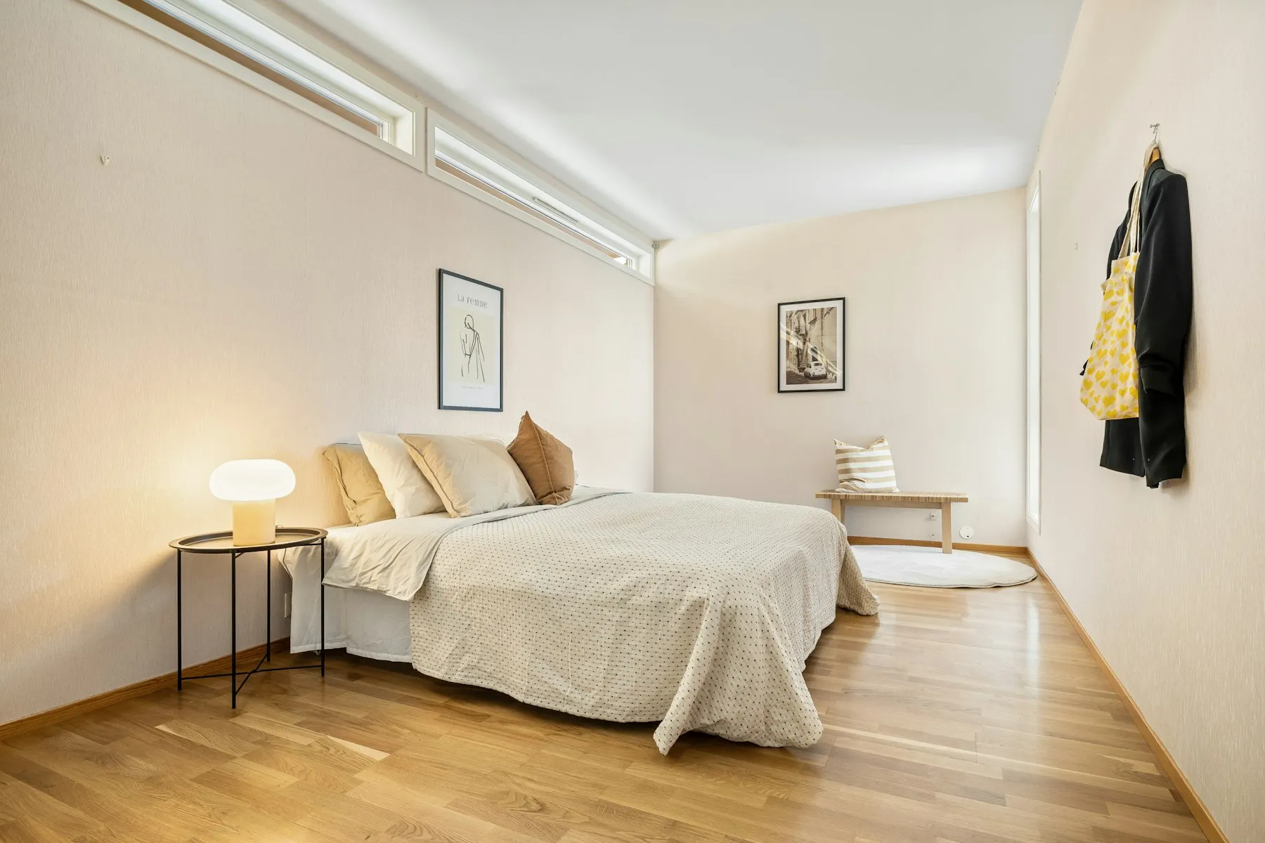 The main bedroom, with a double bed and pale wooden floors