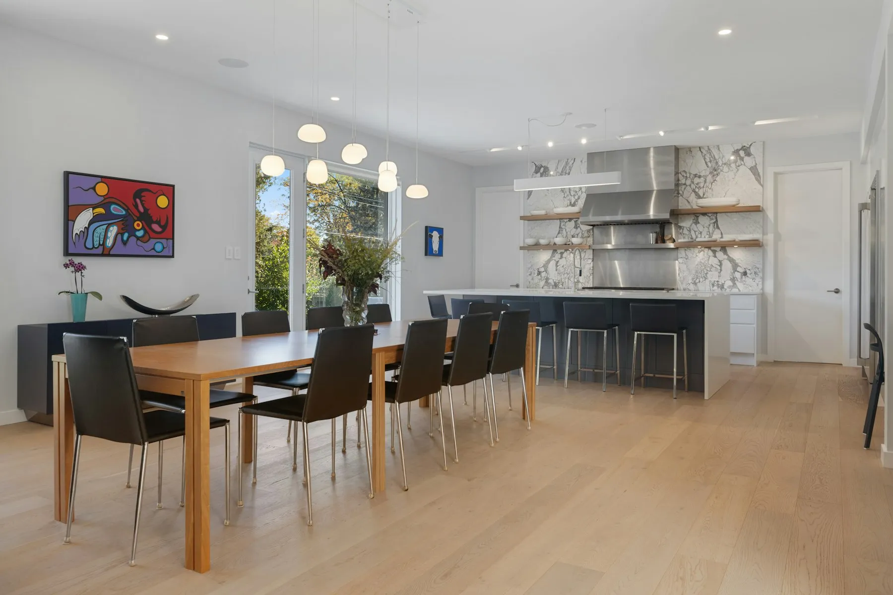 The dining area, with an oak table for eight beside the kitchen