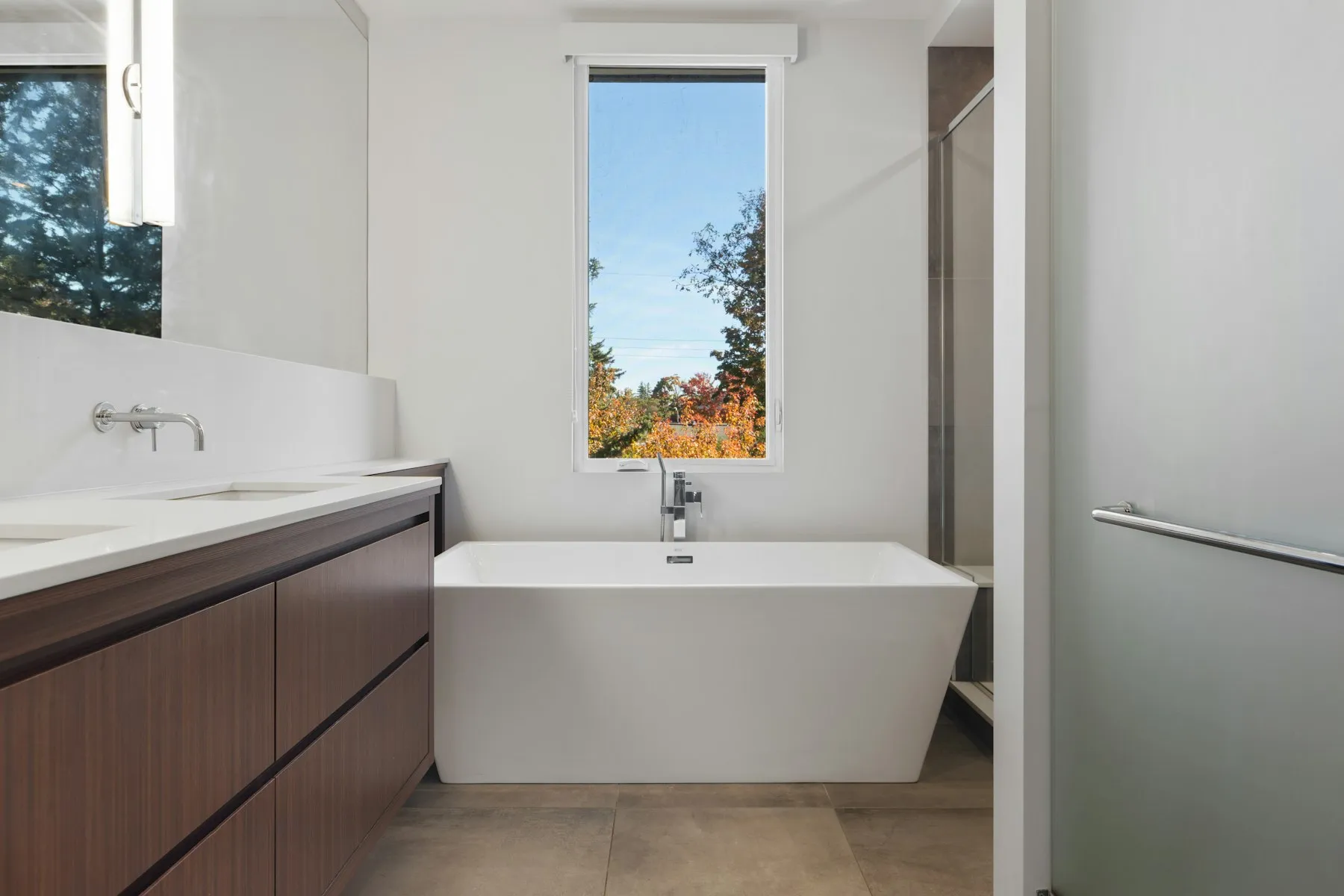 The family bathroom, with a freestanding bath under a tall window