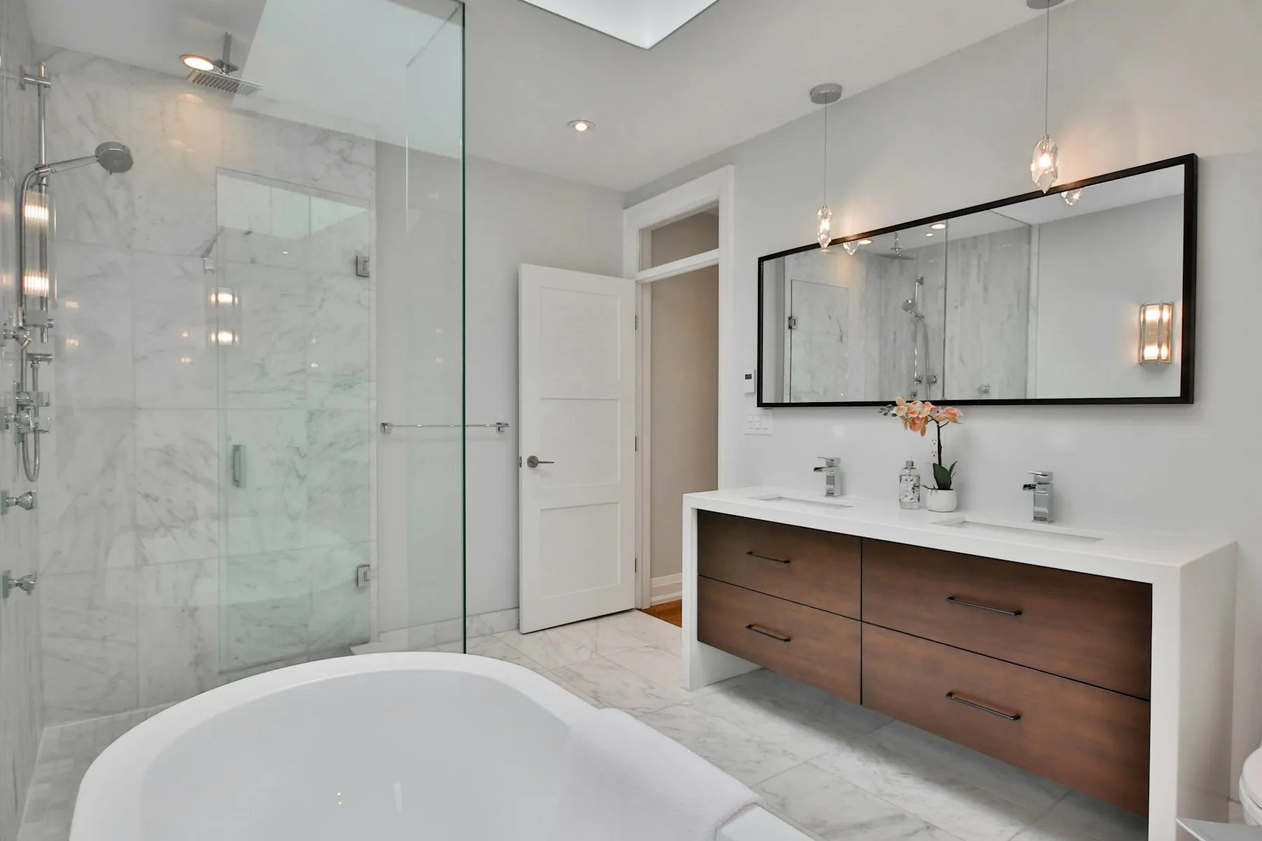The en suite, with a marble shower and a double vanity