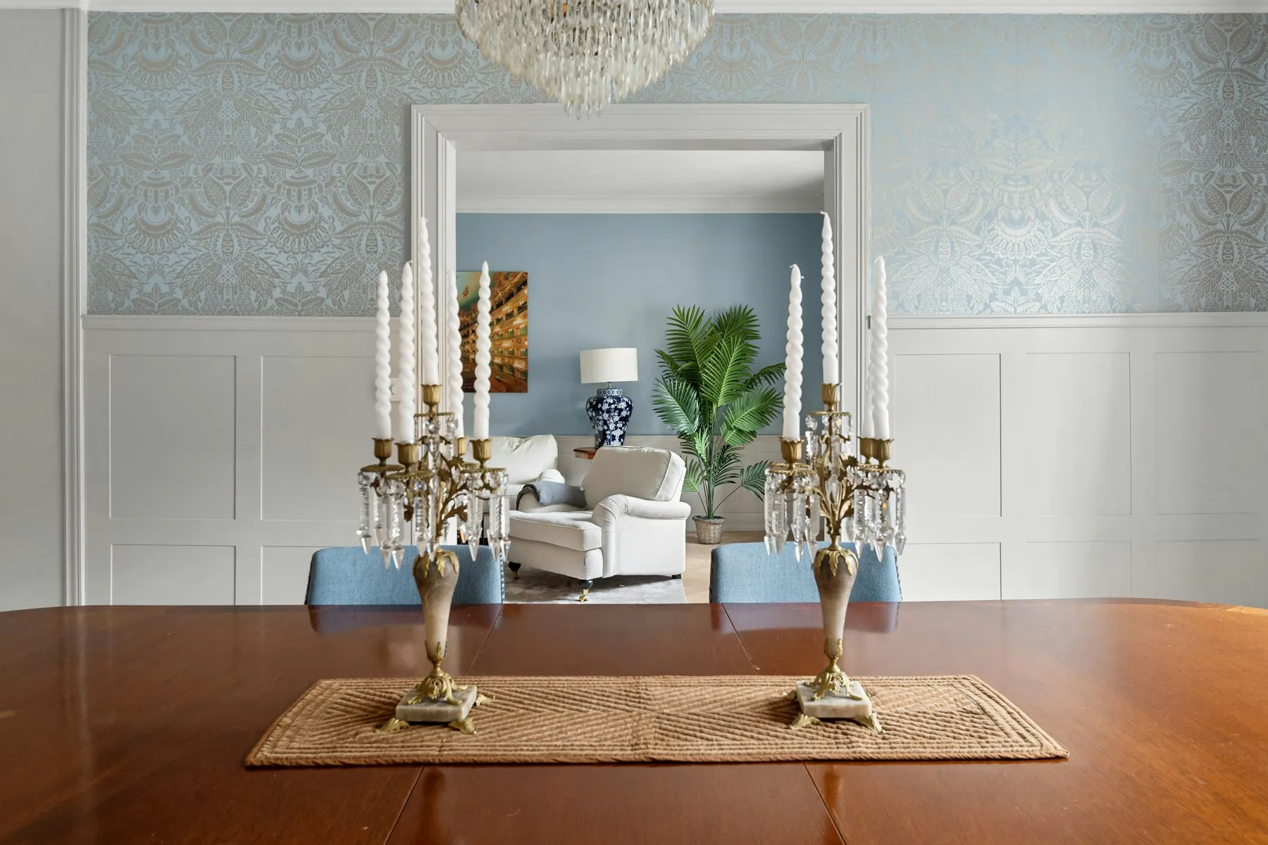 A view across the dining table to the panelled reception room